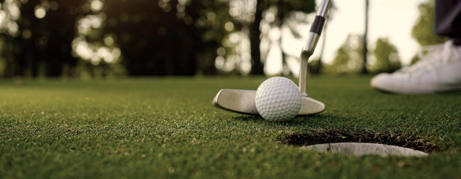 a golf ball on a green field