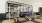 fitness center in a bright well-lit room showing plenty of equipment and modern decor in a large, spacious room