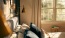 a room with a couch and a lamp